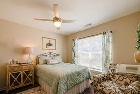 Indianola apartment for rent - a bedroom with a bed and a chair
