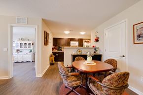 Indianola apartment for rent - a dining area with a table and chairs and a kitchen in the background
