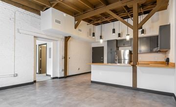 Louisville apartment for rent - A kitchen area with a counter and cabinets.