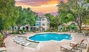 Austin apartment for rent - A large house with a pool in the backyard.