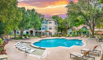 Austin apartment for rent - A large house with a pool in the backyard.