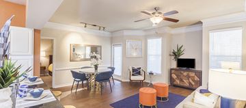 Austin apartment for rent - A living room with a dining table and chairs.