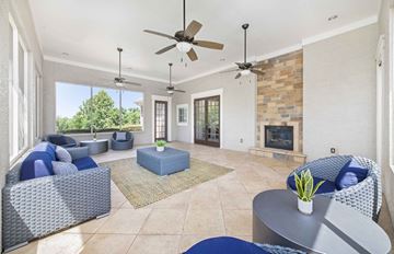 Austin apartment for rent - A living room with a grey sofa and a blue ottoman.