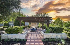 Austin apartment for rent - A beautiful outdoor patio area with a gazebo and a fire pit.