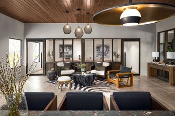 Austin apartment for rent - A modern living room with a zebra print rug and a wooden ceiling.