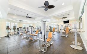 Austin apartment for rent - A gym with a variety of equipment including treadmills, weights, and exercise machines.