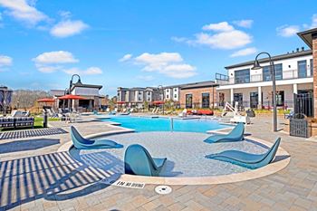 Resort-style swimming pool with cabanas