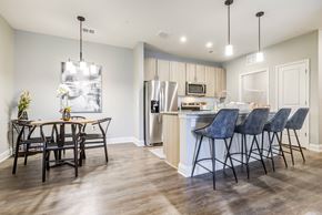 Augusta apartment for rent - a kitchen and dining area in a 555 waverly unit