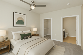Knoxville apartment for rent - A bedroom with a bed, nightstands, and a ceiling fan.