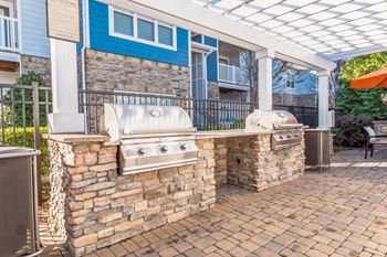 Open air kitchen & dining space with gas grilling areas