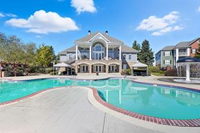 Augusta apartment for rent - A large house with a pool in front.