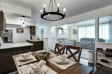 Wyoming apartment for rent - a dining room and living room with a table and chairs and a kitchen with a sink and