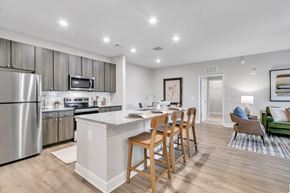 Cartersville apartment for rent - A modern kitchen with a dining table and chairs.