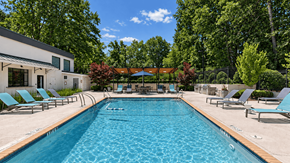 Decatur apartment for rent - Swimming pool with lounge chairs beside the clubhouse at Icon Avondale Apartments in Decatur, GA.