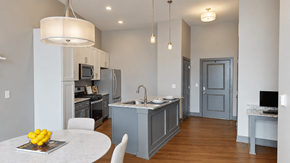 Carmel apartment for rent - A modern kitchen with a dining table and chairs.