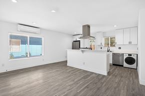 Los Angeles apartment for rent - A kitchen with white cabinets and a wooden floor.