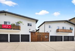 Los Angeles apartment for rent - A white building with a red sign that says "RED OX" on it.