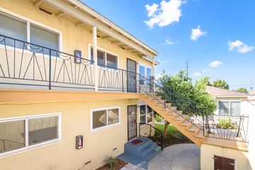 Inglewood apartment for rent - A yellow building with a black railing on the balcony.