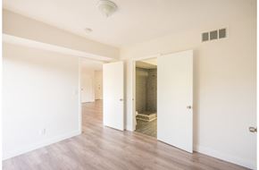 Los Angeles apartment for rent - an empty living room with white walls and a walk in shower