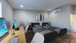 Los Angeles apartment for rent - A modern bedroom with a large bed and a desk with a computer.