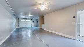 Los Angeles apartment for rent - A spacious room with a ceiling fan and a door on the right side.