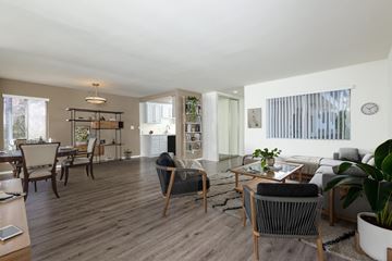 Studio City apartment for rent - A living room with a grey sofa and a wooden coffee table.