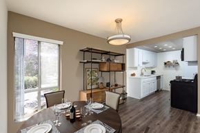 Studio City apartment for rent - A dining room with a table set for two with a view of a backyard.
