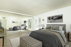 Studio City apartment for rent - A bedroom with a large bed and a mirrored wall.