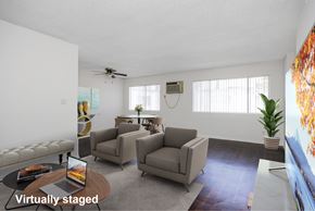 San Gabriel apartment for rent - A living room with a couch, chairs, and a coffee table.