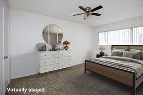 San Gabriel apartment for rent - A bedroom with a bed, dresser, and mirror.