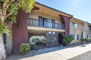 Van Nuys apartment for rent - a building with a gate in front of it