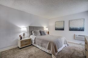 Carson apartment for rent - a bedroom with a bed and two paintings on the wall