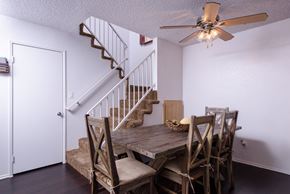 Fontana apartment for rent - an image of a dining room with a table and chairs and a ceiling fan