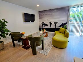 Venice apartment for rent - A living room with a surfer mural on the wall.