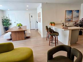 Venice apartment for rent - A living room with a green couch and a wooden table.