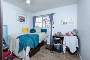 Long Beach apartment for rent - A bedroom with a bed, desk, and chair.