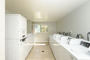 Glendale apartment for rent - a kitchen with white counters and appliances and a window