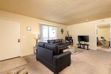San Pedro apartment for rent - a living room with leather couches and a tv