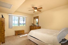 San Pedro apartment for rent - a bedroom with a bed and a ceiling fan