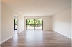 Los Angeles apartment for rent - an empty living room with wood floors and sliding glass doors