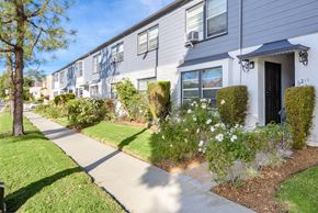 Los Angeles apartment for rent - a white house with a sidewalk in front of it