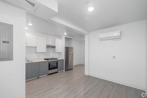 Los Angeles apartment for rent - A kitchen with a refrigerator, oven, and cabinets.