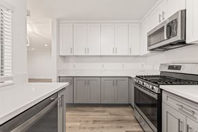 Los Angeles apartment for rent - A kitchen with white cabinets and a stainless steel oven.