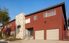 Whittier apartment for rent - a red building with two garage doors