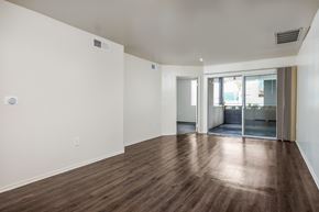 Northridge apartment for rent - a bedroom with hardwood floors and white walls