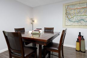 Chatsworth apartment for rent - a dining room with a table and chairs and a map on the wall