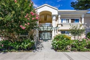 Chatsworth apartment for rent - a house with a walkway and flowering plants in front of it