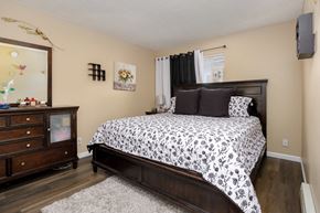 Chatsworth apartment for rent - a bedroom with a bed and a dresser and a window