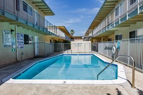 Chatsworth apartment for rent - a swimming pool in a building with a fence around it