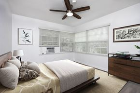 Beverly Hills apartment for rent - a bedroom with a large bed and a ceiling fan